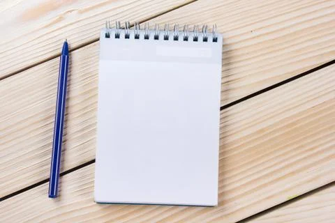 Back to school. Blank note pad, notebook with pen and glasses Stock Photos