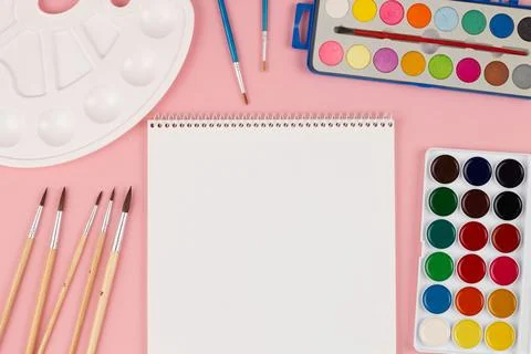 Back to school. Brushes, paints and palette on the table. A set of brushes Stock Photos