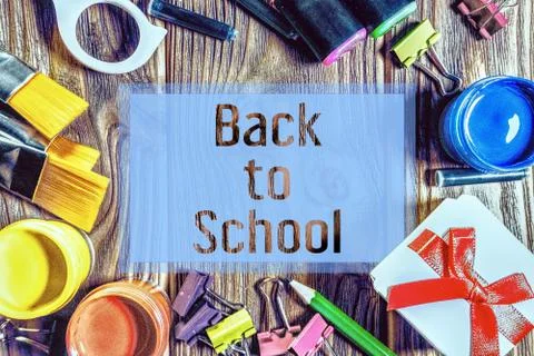 Back to School card. Border with gift box, scissors, paint brushes, acrylic Stock Illustration