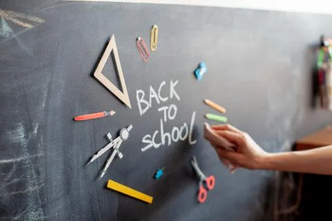 Back to school on chalkboard background. Stock Photos
