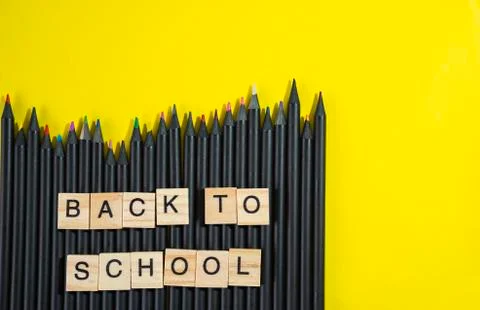 Back to school collected from wooden elements letter block on bunch of colour 库存照片