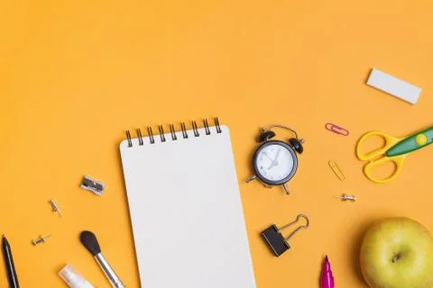 Back to school composition with different stationery on the yellow background Stock Photos