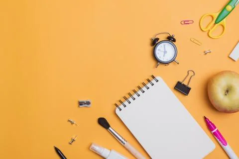 Back to school composition with different stationery on the yellow background Stock Photos