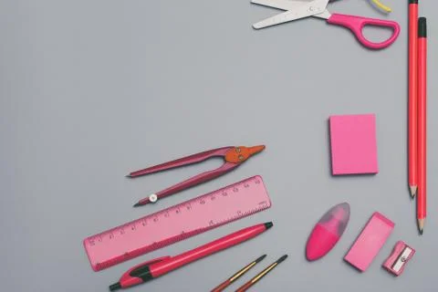 Back to school concept background with pink school accessories. Stock Photos