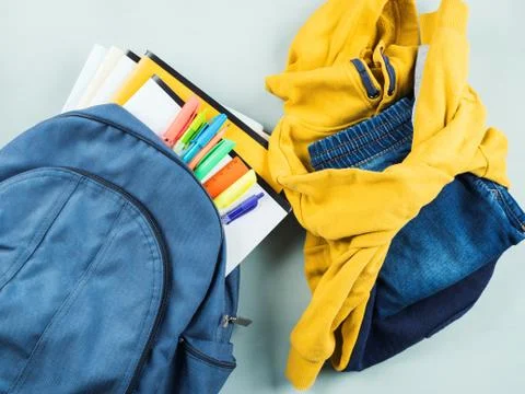 Back to school concept with backpack and clothes Stock Photos