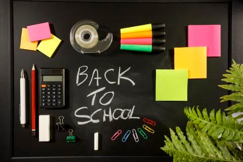 Back to school concept on black flat lay, back to school written with chalk Stock Photos