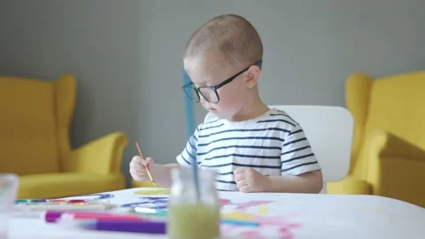Back to school concept boy elementary age preschooler child in glasses painting Video stock 201112070