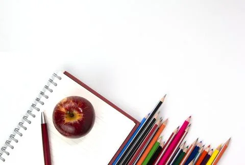 Back to school concept with education materials, note book, apple, pen isolat Stock Photos