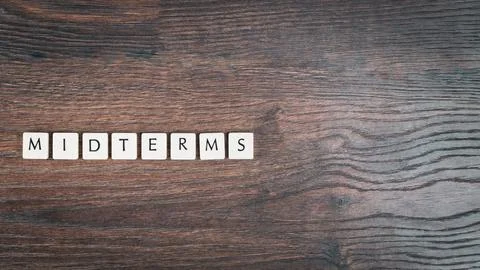 Back to school concept. Finals week word on wooden desk. Stock Photos