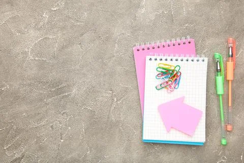 Back to school concept on grey concrete background. Top view Stock Photos