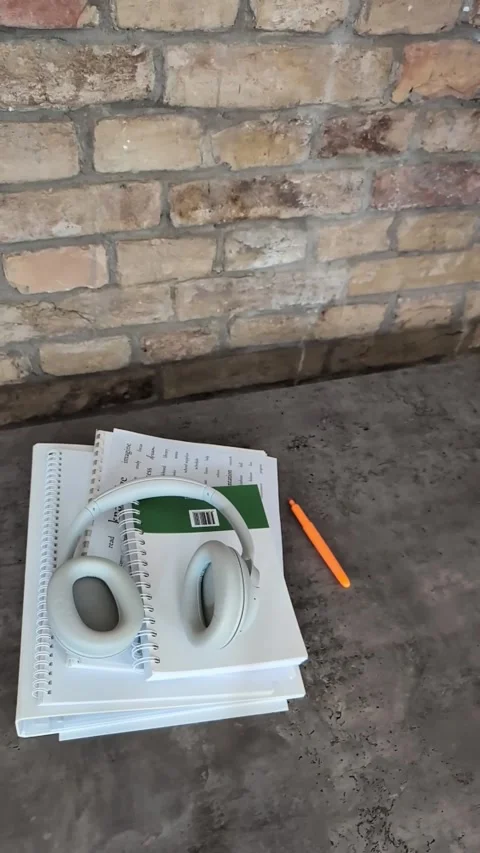 Back to school concept with headphones,  notebooks and highlighters rolling Stock Footage 338225512