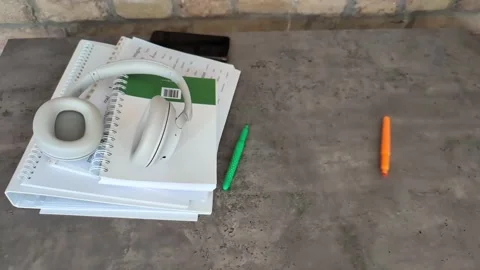 Back to school concept with   headphones,  notebooks and highlighters rolling Stock Footage 338228972