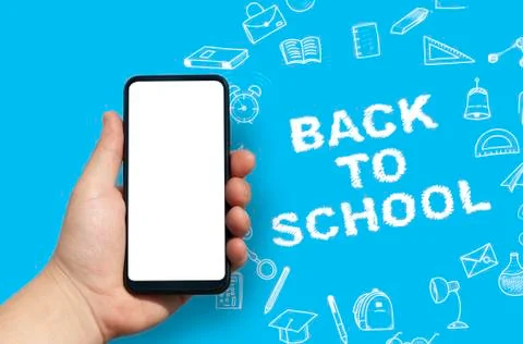 Back to School concept. Man Hand holding the black Mockup smartphone with Stock Photos