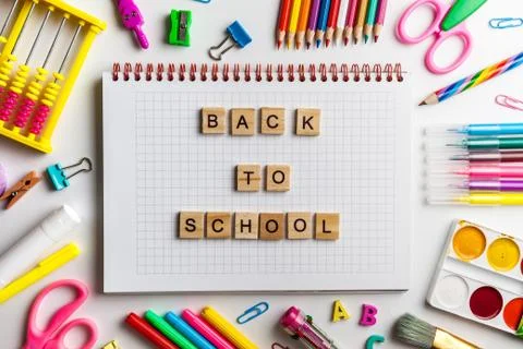 Back to school concept. Open notebook with school supplies Stock Photos