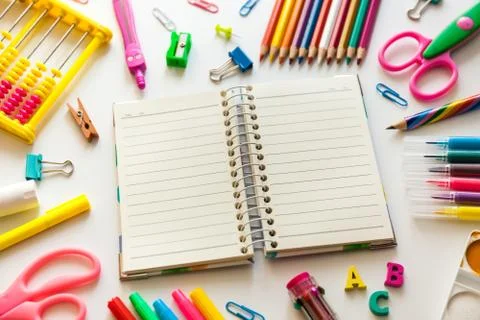 Back to school concept. Open notebook with school supplies Stock Photos