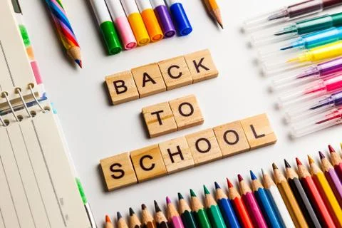 Back to school concept. Open notebook with school supplies Stock Photos