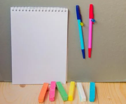 Back to school concept, a pen, Notepad, chalk Stock Photos