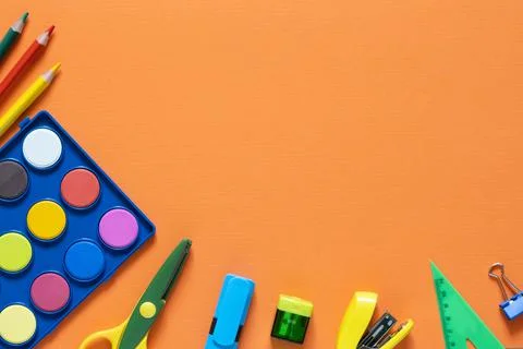 Back to school concept. School and office supplies on the office table. Orange Stock Photos