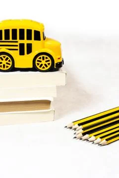 Back to school concept with school bus toy, books Stock Photos