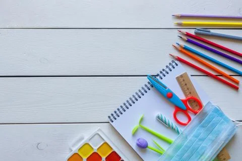 Back to school concept school office supplies on a white wooden backgrounf Stock Photos