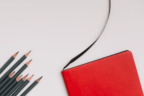 Back to school concept, school or office supplies, notebook and pencils on white Stock Photos