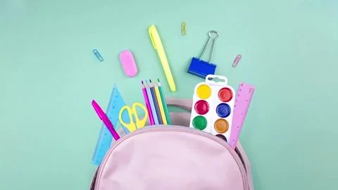 Back to school concept. School supplies are collected in a backpack. Stock Footage 281854999