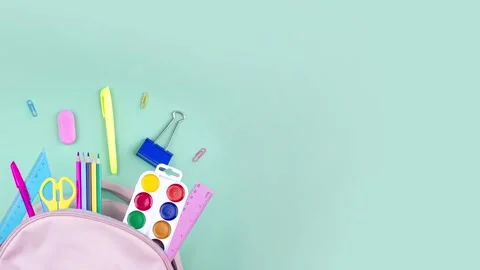 Back to school concept. School supplies are collected in a backpack. Pastel Stock Footage 282696596