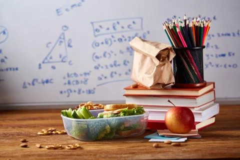 Back to School concept, school supplies, biscuits, packed lunch and lunchbox Stock Photos