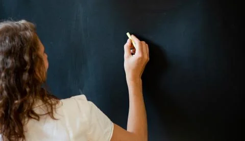Back to school concept teacher in front of chalkboard Stock Photos