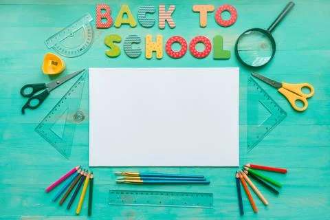 Back to school concept. Text, blank, school supplies, and autumn dry leaves o Stock Photos