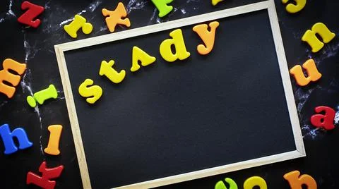 Back to school concept. Text Study on Black blackboard with coloful letters. Stock Photos