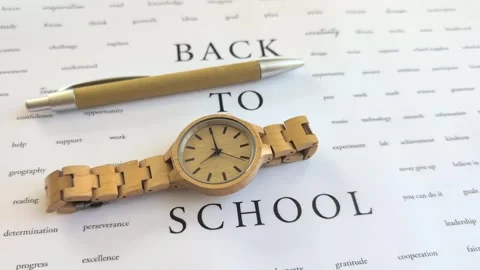 Back to School concept with wooden watch and pen Stock Footage 337126596