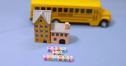 Back to school conceptual arrangement made with Building and school bus toys. Stock Footage 314589417