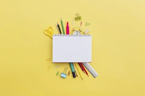 Back to school conceptual flat lay with different office supply objects and copy Stock Photos