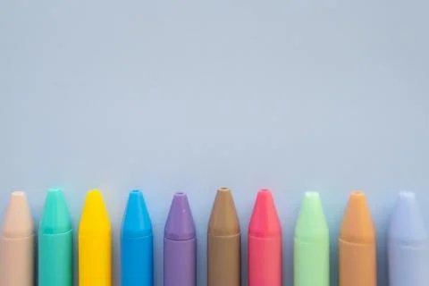 Back to school creative composition with yellow bus note card colorful pens.. Stock Photos