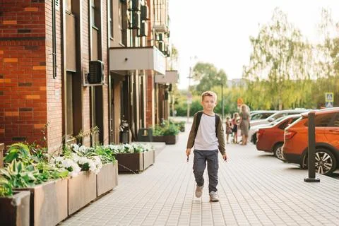 Back to school. Cute child with backpack running and going study to school. Boy Stock Photos