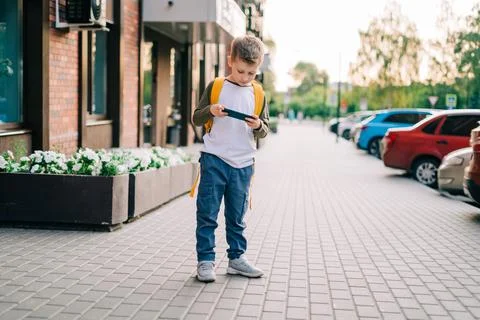 Back to school. Cute child with backpack running and going study to school. Boy Stock Photos