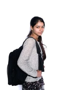 Back to school: cute indian student smiling with backpack, over isolated whit Stock Photos