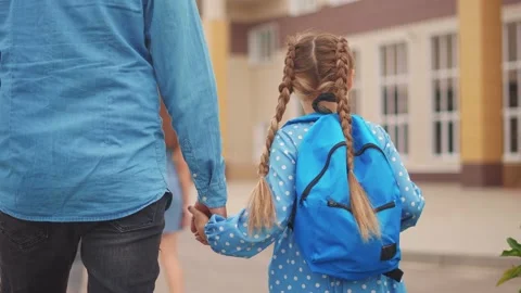 Back to school. dad takes his daughter to school. schoolgirl carries go to Video stock 169614297