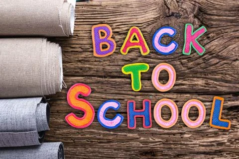 Back to School desk table top view, words on grunge old wooden board background Stock Photos