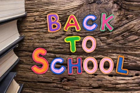 Back to School desk table top view, words on grunge old wooden board background Stock Photos