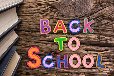 Back to School desk table top view, words on grunge old wooden board background Stock Photos