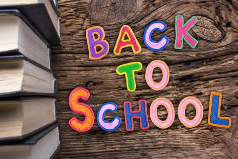 Back to School desk table top view, words on grunge old wooden board background Stock Photos