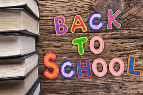 Back to School desk table top view, words on grunge old wooden board background Stock Photos