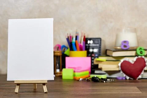 Back to School displayed on a mini easel Accompanied by Colorful Supplies and Bo Stock Photos