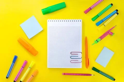 Back to school, drawing. Notebook checkered with pencil for notes to text Stock Photos