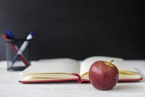 Back to school, education and knowledge concept, apple and note book on tab.. Fotos de archivo