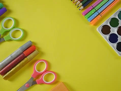 Back to school, education. Back to school yellow background with scissors, pa Stock Photos
