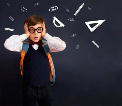 Back to school. Education. Scared or surprised little boy with a drawn school Foto stock