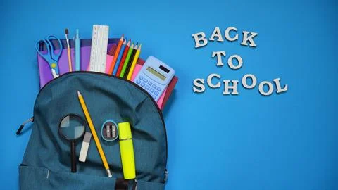 Back to school essentials in a backpack with pencils,ruler and colorful supplies Stock Photos